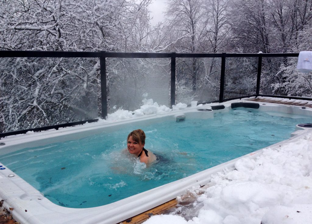 Woman in Swim Spa in the Snow